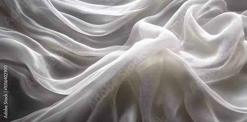 Soft white fabric with elegant, flowing folds.