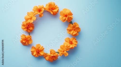 Marigold flower and leaves rounded frame blank center space nature background