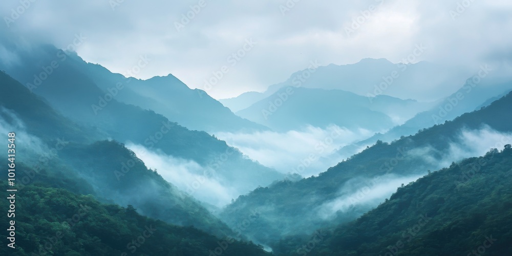 Misty Mountains Shrouded in Fog with a Valley Below Misty Mountains Shrouded in Fog with a Valley Below