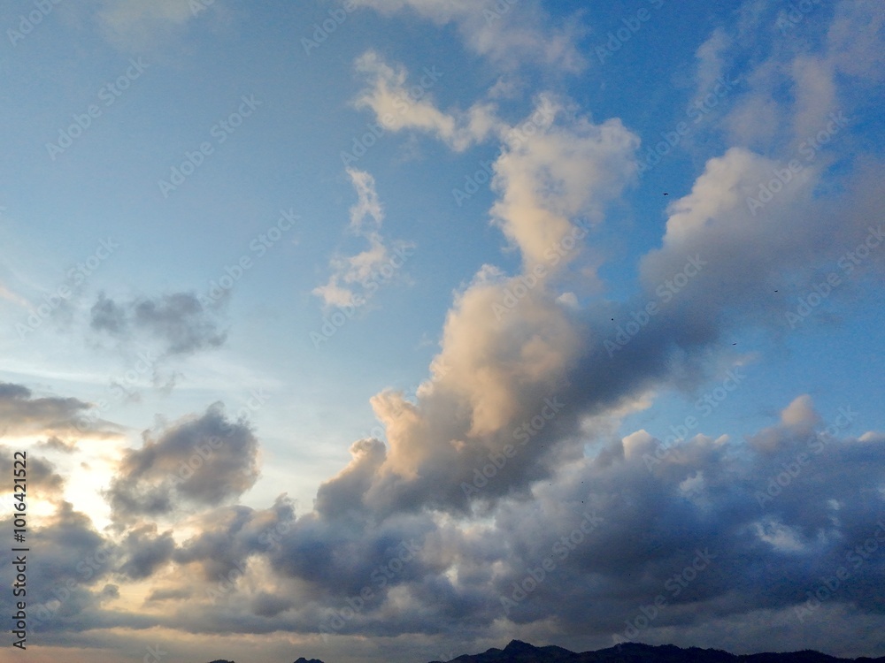beautiful cloudy sky sunlight from the side, dramatic feel, it's going to rain