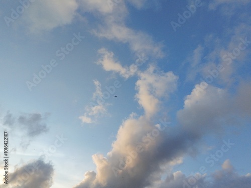 beautiful cloudy sky sunlight from the side, dramatic feel, it's going to rain