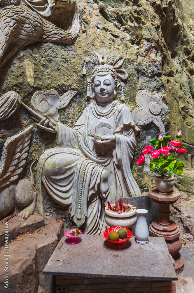 Buddhist temple with statues and sanctuary inside the Am Phu Cave in Marble Mountains in Da Nang in Vietnam Buddhist temple with statues and sanctuary inside the Am Phu Cave in Marble Mountains in Da Nang in Vietnam