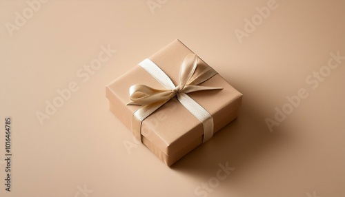 Minimalist modern looking gift box tied on smooth beige background