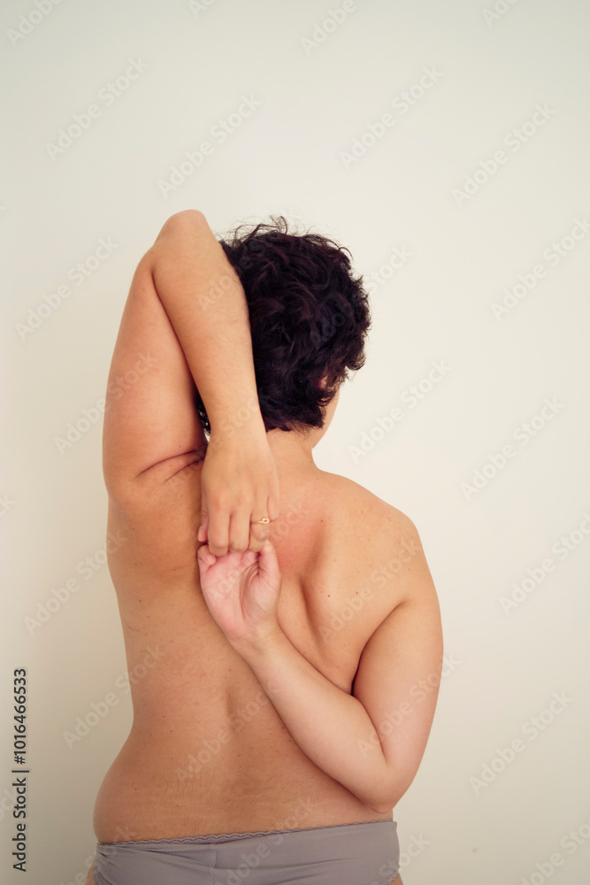 young plus size woman topless in panties from the back young plus size woman topless in panties from the back