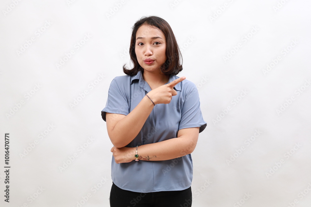 Portrait of asian business woman, looking impressed and showing advertisement, pointing fingers right, standing over white background Portrait of asian business woman, looking impressed and showing advertisement, pointing fingers right, standing over white background