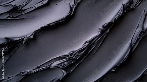 Elegantly smooth abstract piece featuring flowing black textures, creating a minimalist yet dramatic visual impact through its simplicity and deep hues. photo