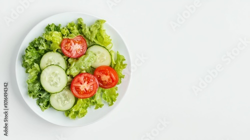 Clean, natural organic salad with fresh ingredients like tomatoes, cucumbers, and leafy greens on a minimalist plate