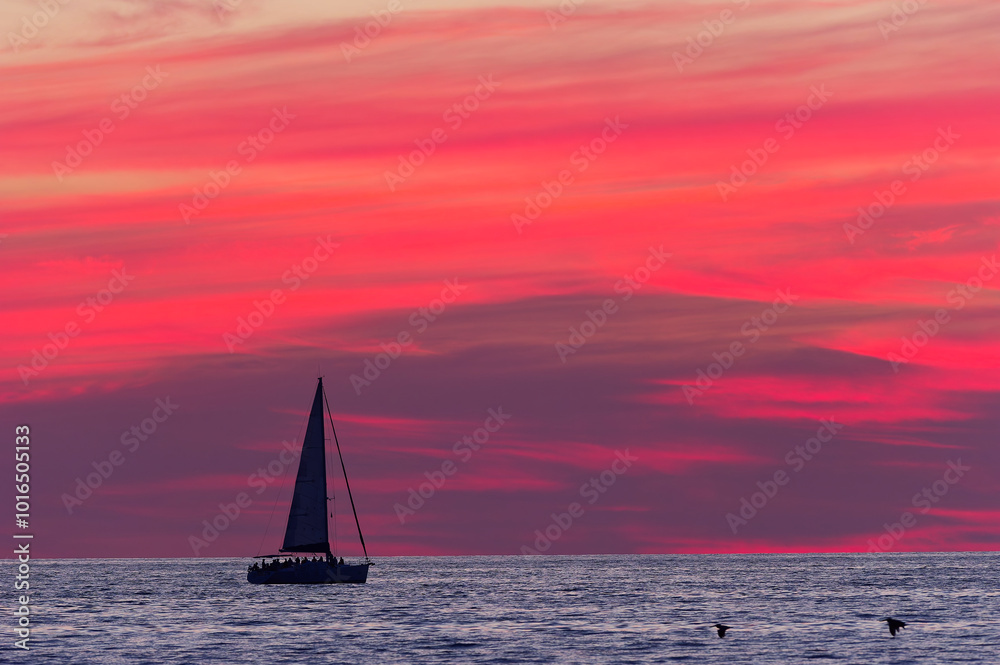 Fototapeta premium Sunset Ocean Sailboat Silhouette Beautiful Surreal Sunrise Sky Sailing Summer Sea Travel Vacation Adventure