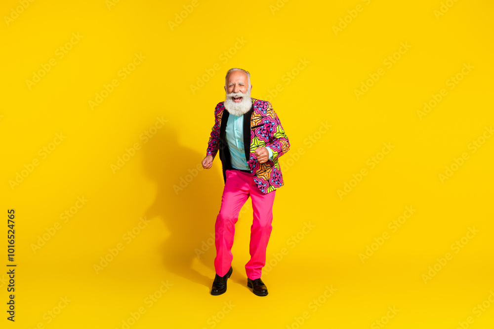 Photo of positive old man in glamour outfit dancing moving isolated yellow color background Photo of positive old man in glamour outfit dancing moving isolated yellow color background