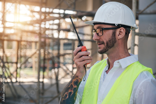 Construction industry workers talking on the radio communicating with workers, professional engineer architects, Male caucasian development architecture working in building site structure.