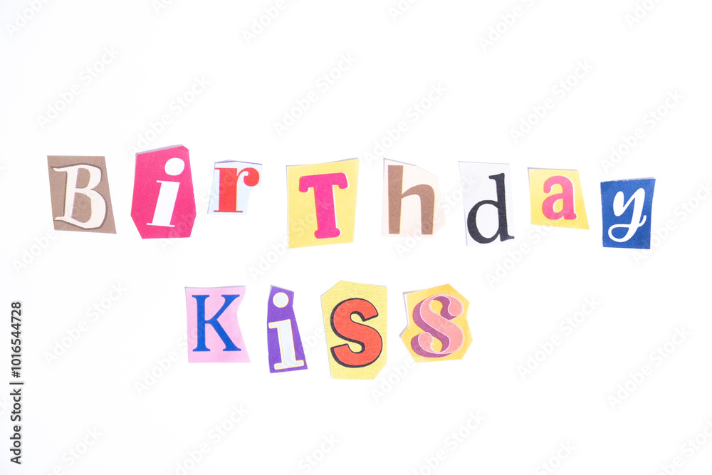 Obraz premium Happy Birthday symbol. Concept words Birthday Kiss isolated on clean white background in fun cut out newspaper style typescript. Concept birthday celebration.