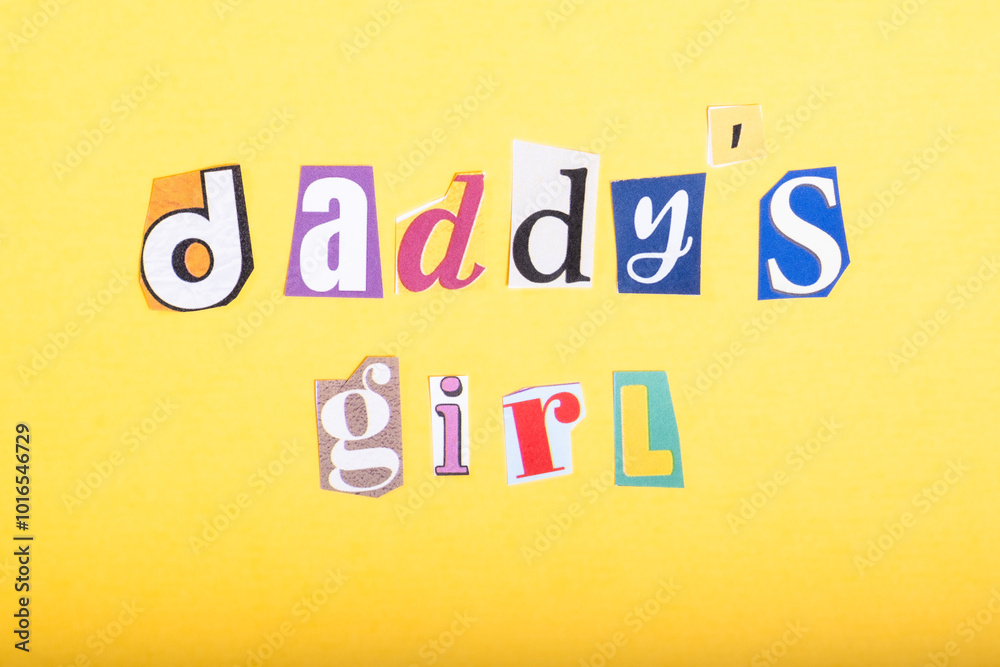 Phrase Daddy's Girl spelled in cut out newspaper style typography, isolated on yellow background. Phrase Daddy's Girl spelled in cut out newspaper style typography, isolated on yellow background.