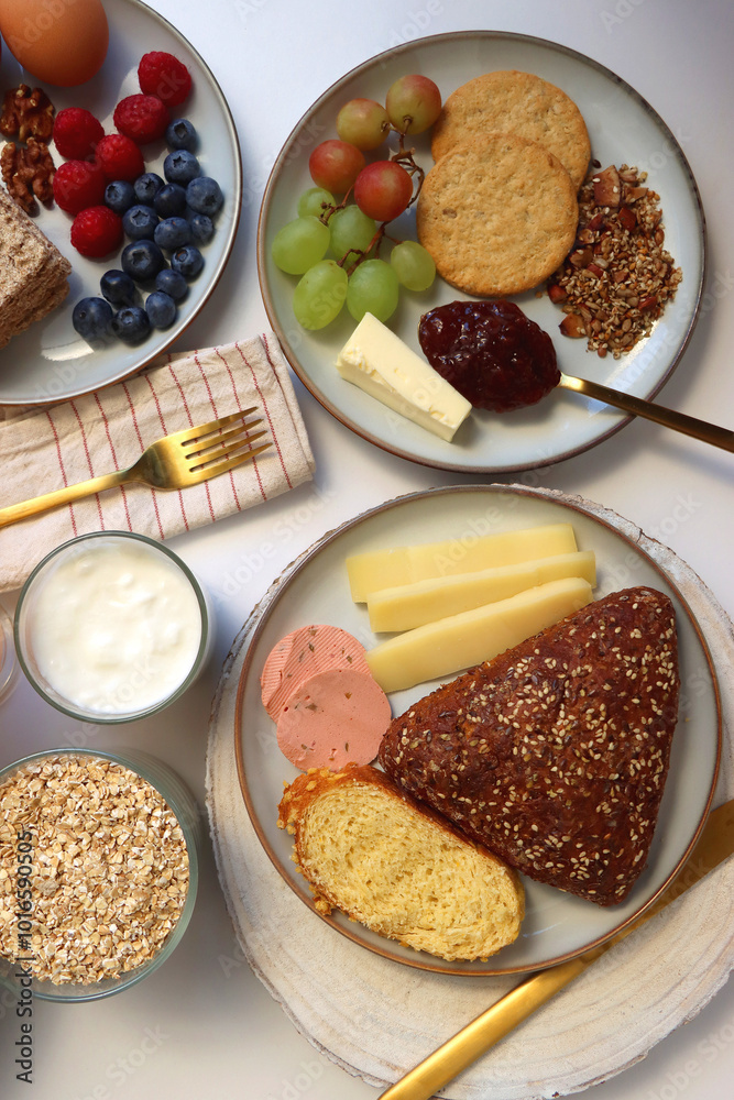 Assortment of various breakfast foods and drinks on the white table. Flat lay. Assortment of various breakfast foods and drinks on the white table. Flat lay.