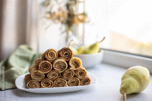 pancakes on a light plate are on the table. Healthy breakfast at home photo