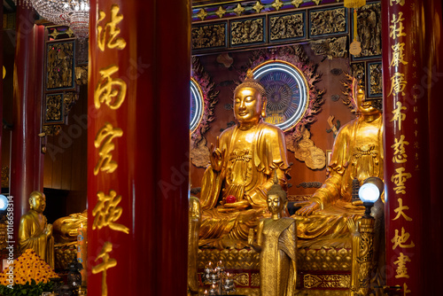 Obraz na płótnie Golden Buddha Statue in Wat Mangkon Kamalawat known as Wat Leng Noei Yi, is the largest and most important Chinese Buddhist temple and hosts celebrations of a number of year-round events w salonie