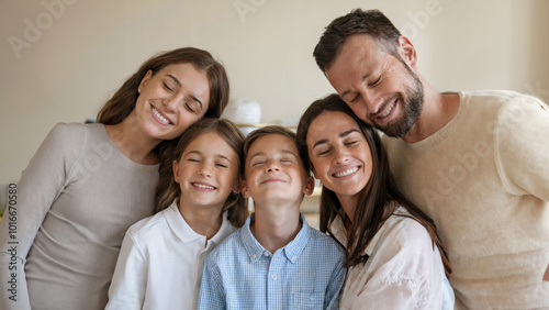 Smiling family of five sharing a warm moment together, radiating happiness, love, and unity at home.