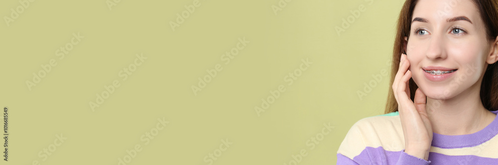 Beautiful woman with braces smiling on color background. Banner design with space for text Beautiful woman with braces smiling on color background. Banner design with space for text