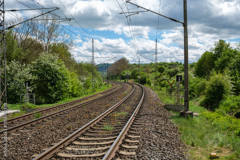 Railway outdoors on beautiful summer day. Industrial landscape with rails and railway.