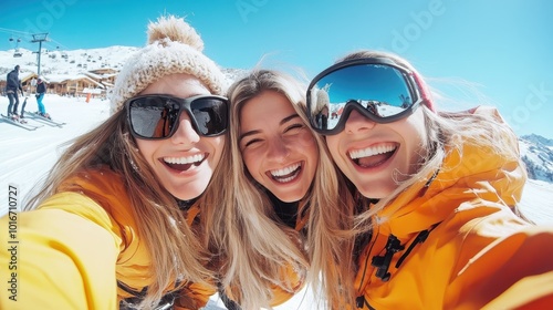 Three friends wearing orange jackets enjoy a sunny day skiing on a snowy mountain, capturing their excitement and joy in a cheerful selfie. photo