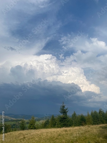 A striking display of the sky, with dramatic contrast between dark grey and bright white clouds. The sharp distinction and dynamic atmosphere hint at shifting weather patterns.