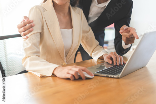 Slika na platnu Disgusted asian young employee, pressure business woman uncomfortable, looking hand of boss or colleague  male when touching her shoulder, embrace