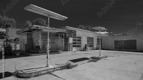 A derelict gas station straddles the Boulevard of Broken Dreams somewhere in Vanishing Small-town America.  Tonasket, Washington, USA. photo