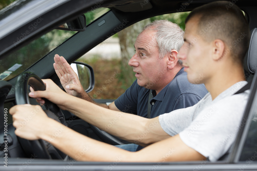 driving test teacher giving instructions to student driving test teacher giving instructions to student