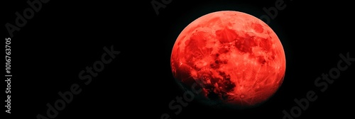  A tight shot of a ruddy moon against the backdrop of the dark night sky, with a plane traversing its path in front