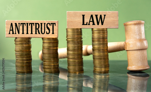 Wallpaper Mural ANTITRUST LAW - words on a white sheet with a judge's gavel and a stack of coins in the background Torontodigital.ca
