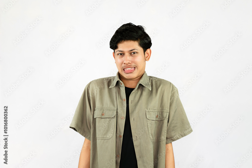 Worried Looking Young Handsome Male Boy with fingers crossed thinking and sad expressions lookg time Worried Looking Young Handsome Male Boy with fingers crossed thinking and sad expressions lookg time