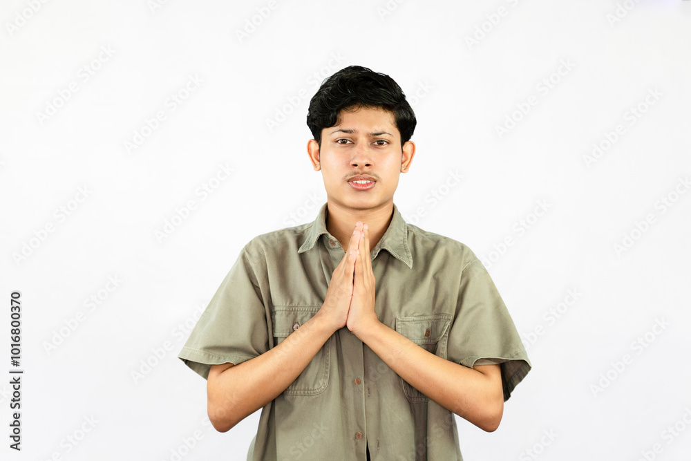 Worried Looking Young Handsome Male Boy with fingers crossed thinking and sad expressions lookg time Worried Looking Young Handsome Male Boy with fingers crossed thinking and sad expressions lookg time