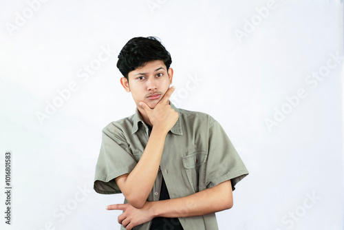 Worried Looking Young Handsome Male Boy with fingers crossed thinking and sad expressions lookg time photo