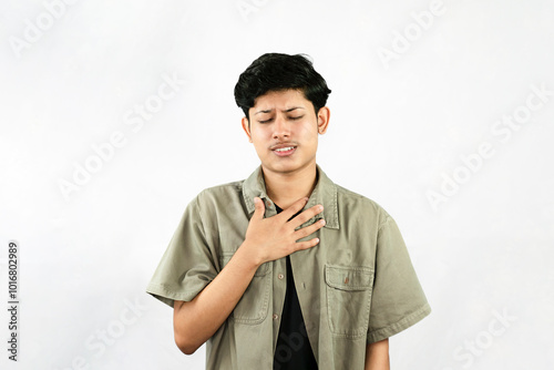 Worried Looking Young Handsome Male Boy with fingers crossed thinking and sad expressions lookg time photo