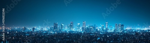 A stunning city skyline illuminated by vibrant blue lights, showcasing modern architecture against a night sky.