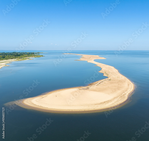 A patch of sand at the mouth of the Vistula River into the Baltic Sea photo