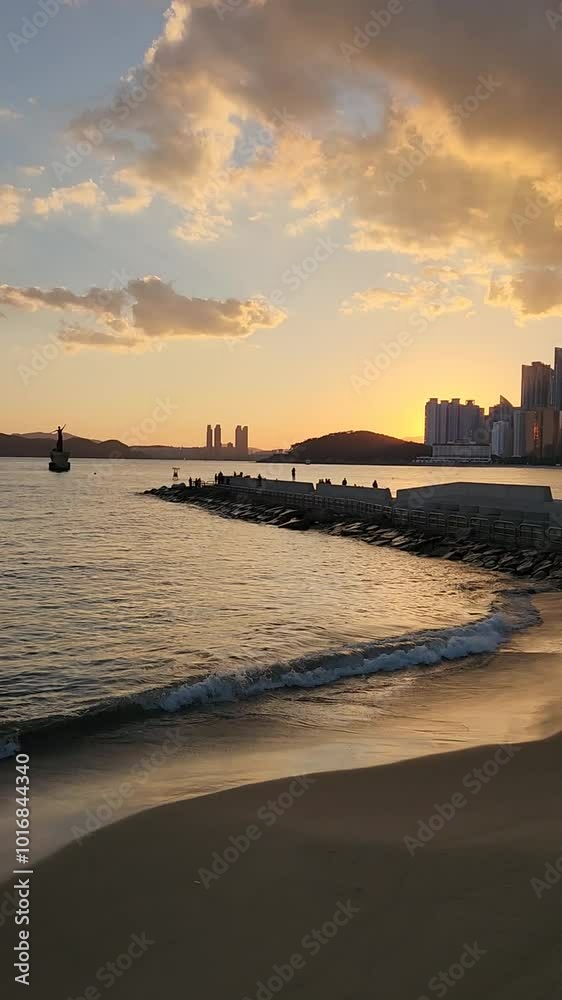 Sunset on the Haeundae beach in Busan, South Korea.
Sunset on the Haeundae beach in Busan, South Korea.