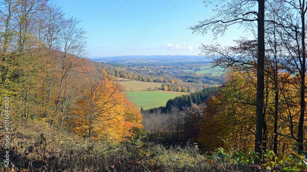 Autumn foliage paints a vibrant landscape in a serene valley under a clear blue sky Autumn foliage paints a vibrant landscape in a serene valley under a clear blue sky