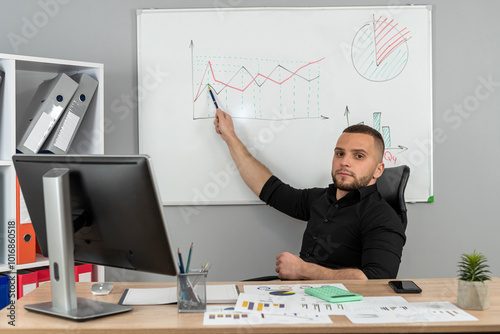 Business man work with finance document and work wiwth computer at modern office photo