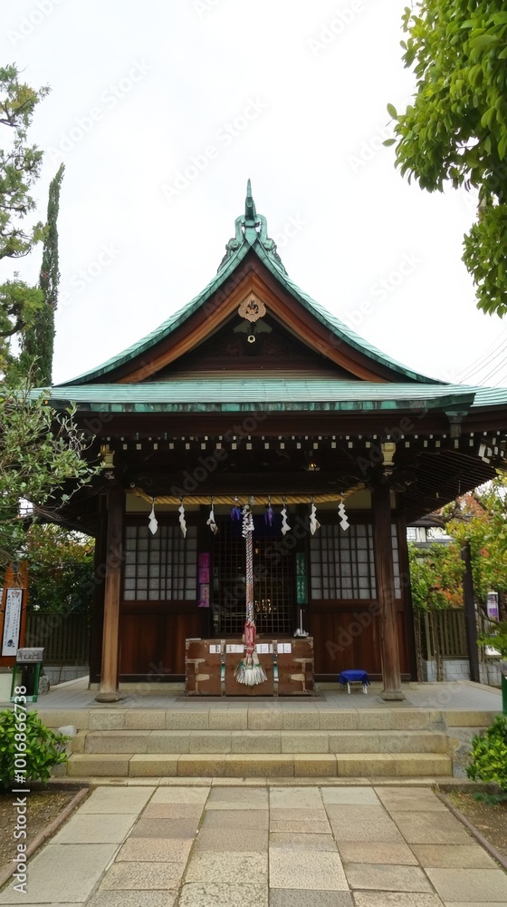 A serene traditional shrine surrounded by lush greenery in a peaceful urban setting A serene traditional shrine surrounded by lush greenery in a peaceful urban setting