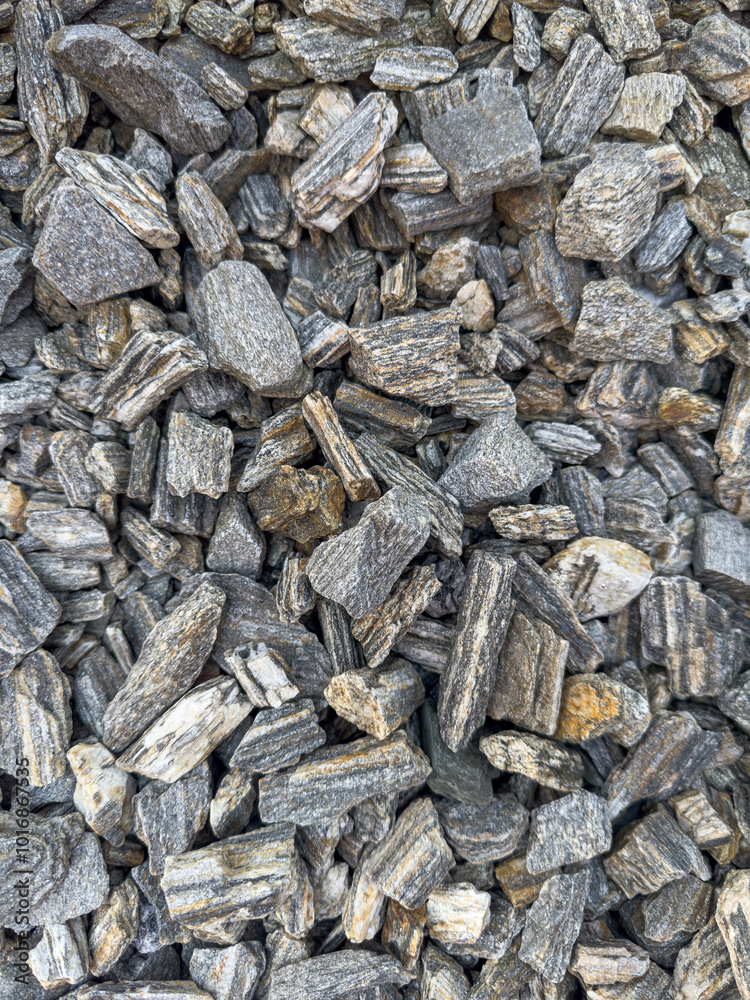 Background of natural gray small pebbles or stone in a garden paths and flower beds. Background of natural gray small pebbles or stone in a garden paths and flower beds.