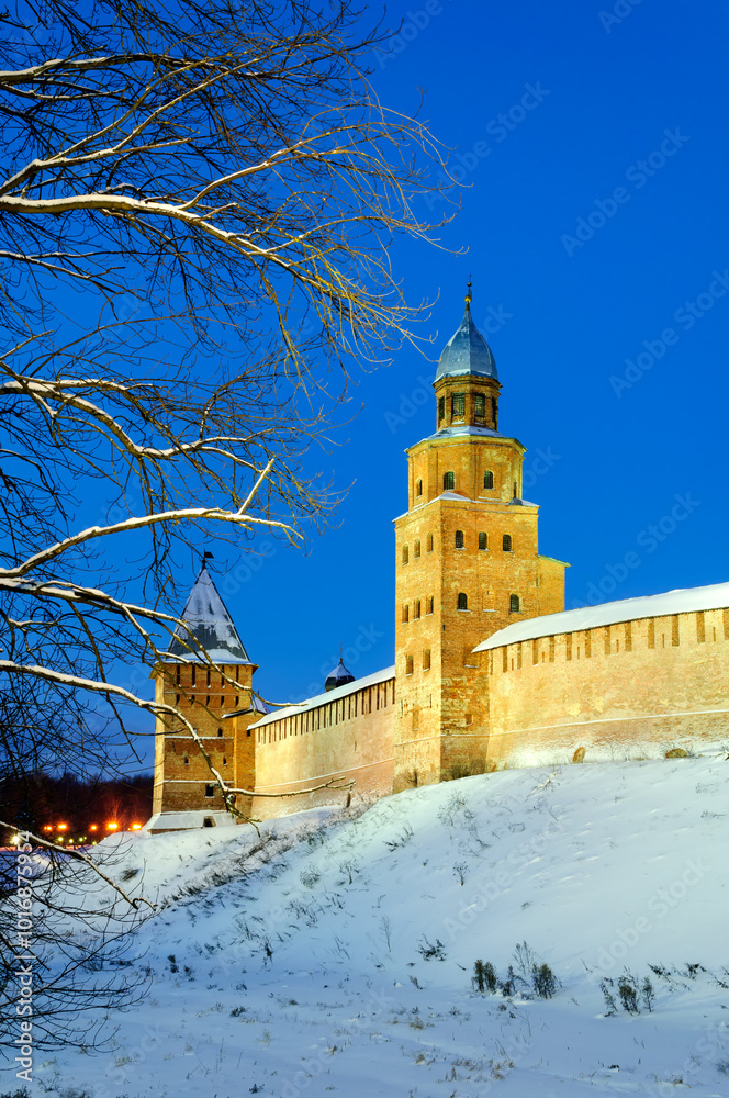 Fototapeta premium Veliky Novgorod Russia - December 8 2010. Kokui and Intercession towers of Veliky Novgorod Kremlin by winter night, Veliky Novgorod Russia