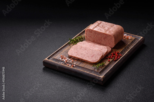 Delicious canned pink spiced ham or spam with salt, spices and herbs photo