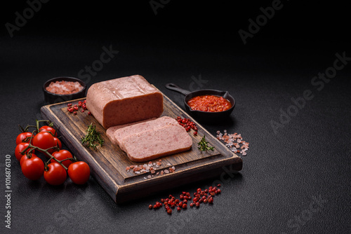 Fototapeta Naklejka Na Ścianę i Meble -  Delicious canned pink spiced ham or spam with salt, spices and herbs
