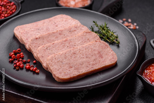 Delicious canned pink spiced ham or spam with salt, spices and herbs photo