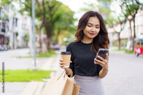 Asian businesswoman walking on the street in city.