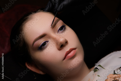 Calm studio atmosphere and sophisticated eyebrow tattooing create a harmonious photo