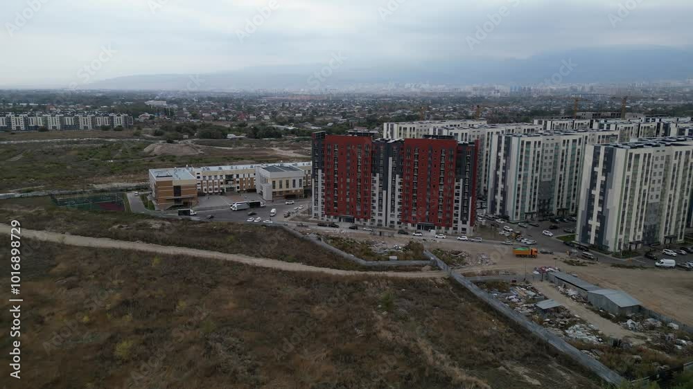 View of the city and residential buildings along one of the central streets. View of the city and residential buildings along one of the central streets.