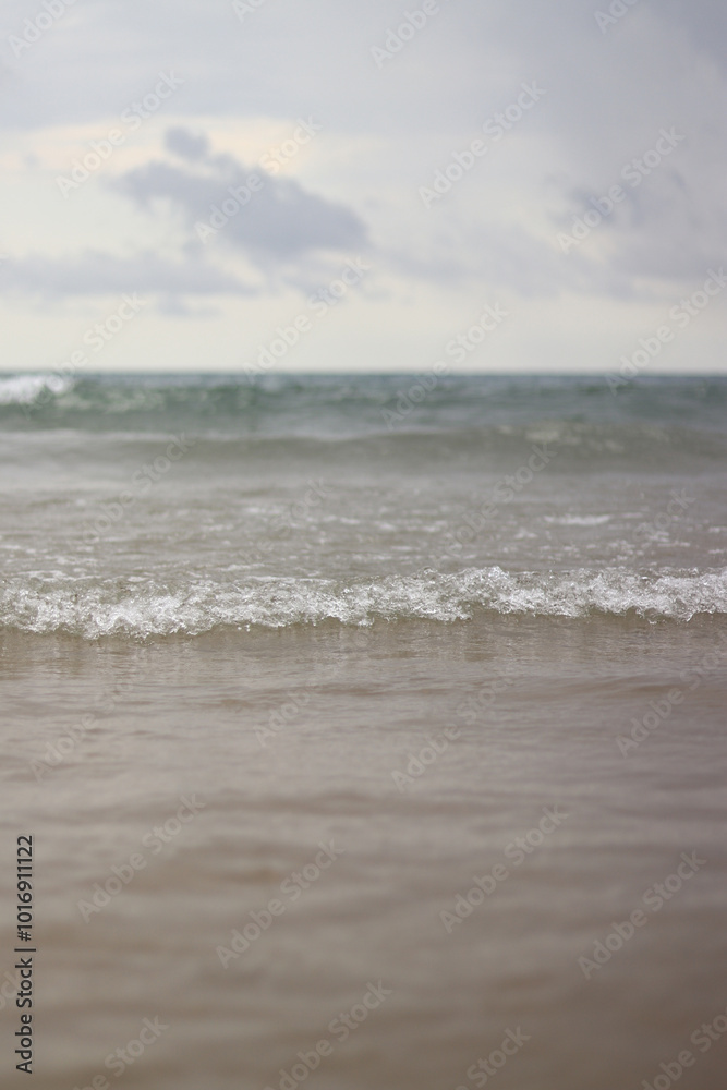 Sea view with small waves in cloudy weather. Balearic Sea, Salou, Spain. View of the waves on the sea from a lower angle. Landscape with sea and clouds Sea view with small waves in cloudy weather. Balearic Sea, Salou, Spain. View of the waves on the sea from a lower angle. Landscape with sea and clouds
