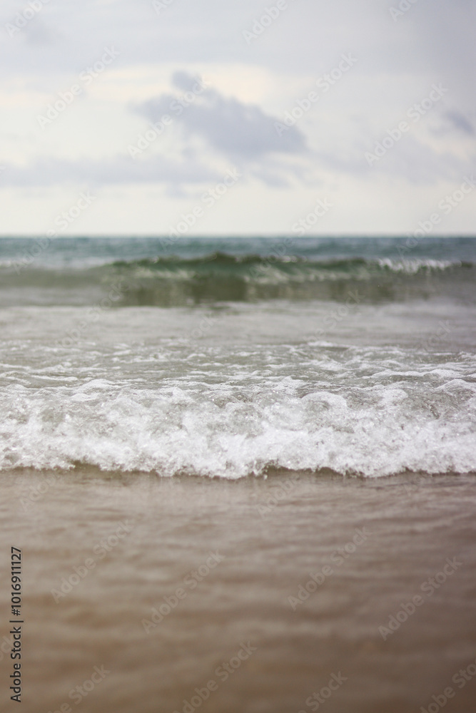 Sea view with small waves in cloudy weather. Balearic Sea, Salou, Spain. View of the waves on the sea from a lower angle. Landscape with sea and clouds Sea view with small waves in cloudy weather. Balearic Sea, Salou, Spain. View of the waves on the sea from a lower angle. Landscape with sea and clouds