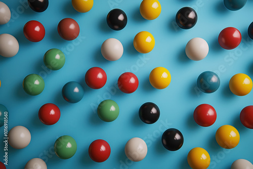 A blue background with many different colored balls scattered across it